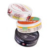 Four different containers of snus on a white background